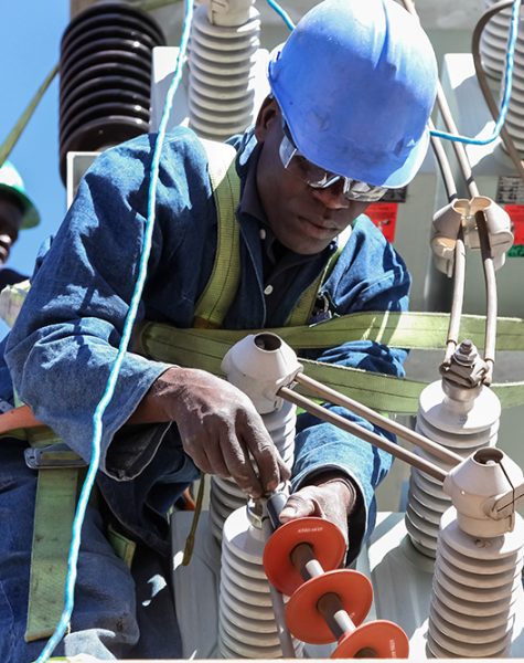 Electricians working on high voltage power lines Johannesburg, South Africa, 04/11/2012, Electricians working on high voltage power lines. Highly skilled workmen servicing the electricity grid